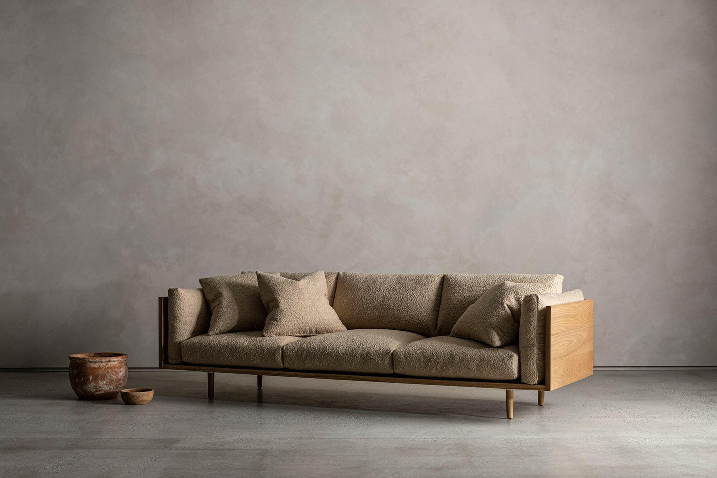 WOOD ENCASED SOFA.