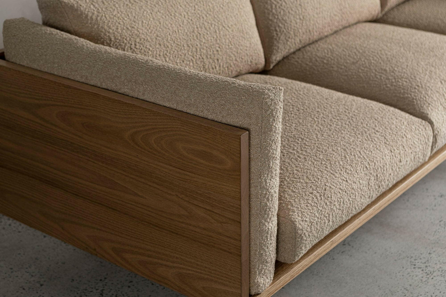 WOOD ENCASED SOFA.